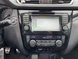 the dashboard of a car with a gps device in the center