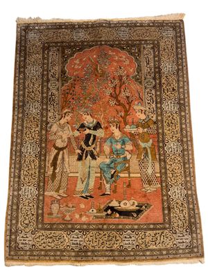 un tapis persan ancien représentant une femme et deux hommes dans un jardin