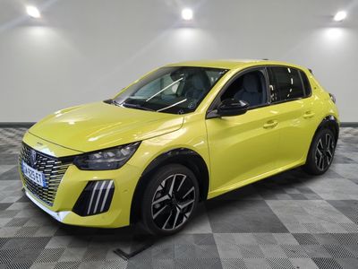 a yellow car is parked in a room with a checkered floor