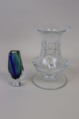 a small glass vase and a small glass vase on a table