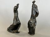 pair of bronze figurines of a man and a woman