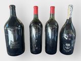 three bottles of wine sitting next to each other