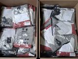 two boxes filled with white and red items sitting on top of a table