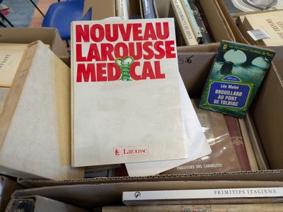 a box full of books that are sitting on a table