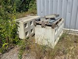 a pile of old appliances sitting outside of a building