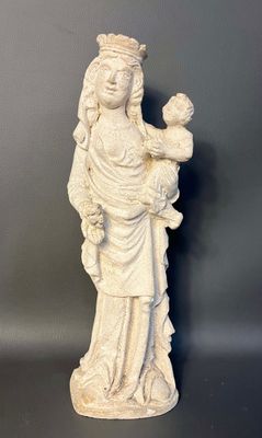 white statue of a woman holding a baby in her arms