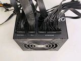 a picture of a computer power supply unit with wires
