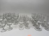 a lot of empty wine glasses on the table