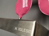 a pink object that is on a metal stand
