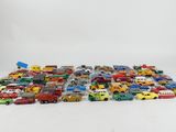 a lot of toy cars that are on the floor