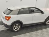 a picture of a white suv parked in a garage