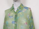 an image of a mannequin wearing a green floral shirt