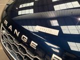 a close up of a range rover badge on the hood of a car