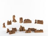 a lot of small wooden figurines that are on a table
