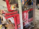a picture of a workbench in a garage with a lot of tools