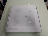 a box that has a white electronic device inside of it