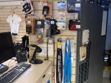 a desk with a computer and a keyboard in a room