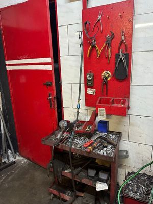 a workbench with tools on it in a garage