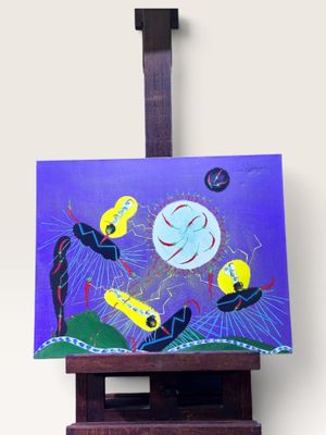 tableau posé sur un chevalet représentant des oiseaux volant dans le ciel