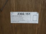 a label on a wooden door that says made in belgium