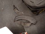 a banana on the floor next to a bag on the floor
