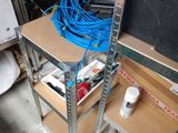 a shelf that has a bunch of wires on it