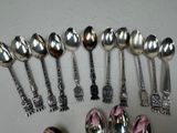 a lot of silver spoons and spoon spoons on the table