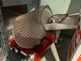 a red machine that is sitting on a shelf