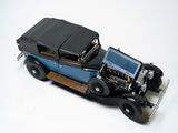 a model of an old car on a white surface