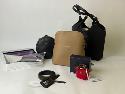 many different types of purses and accessories on the table