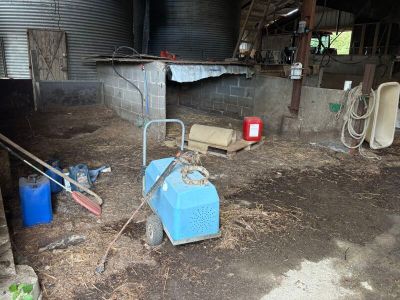 a blue machine that is sitting in the dirt