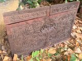 a wooden chest sitting on the ground in the woods