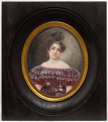 an oval portrait of a woman in a red dress in a black frame