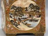 an image of a decorative box with a painting of a landscape on it