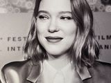 a black and white photo of a woman in a suit