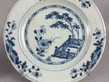 a plate with a blue and white design on it
