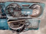 two tools that are sitting in a blue case