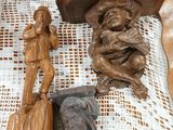 a lot of wood carvings that are on a table