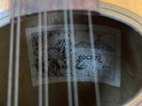 a close up of a guitar with a label on it