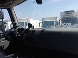 many trucks that are parked in a lot together