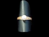 an image of a ring with a pearl on it