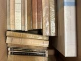 a box full of books that are sitting on the floor
