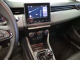 the interior of a car with a touch screen and steering controls