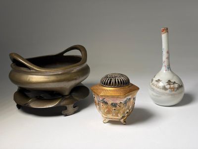 three different types of vases sitting on a table
