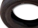 a close up of a tire on a white background