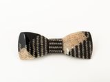 a close up of a bow tie on a white surface