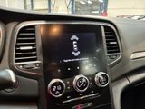 the dashboard of a car with a picture of a man on the screen