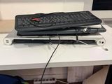 a computer on a desk with a keyboard and a mouse