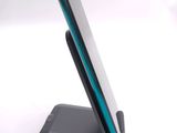 a cell phone that is on a stand on a table