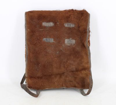 an image of a small brown bag with a brown fur on it